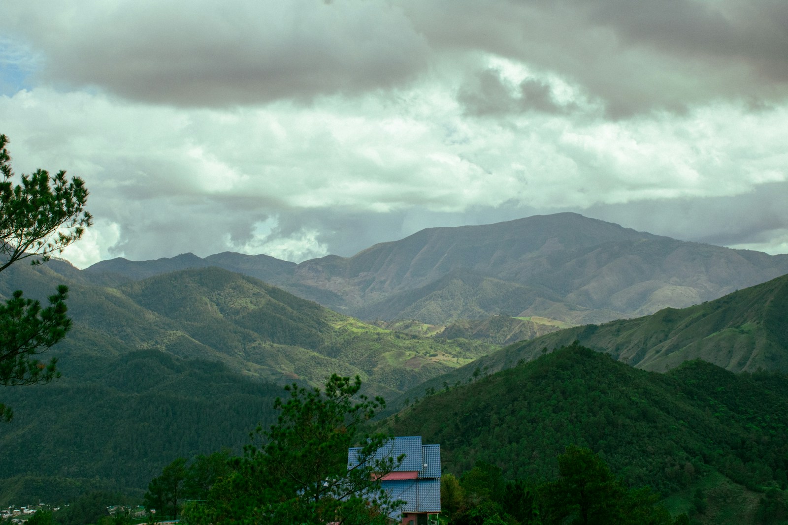 A view of a mountain range with a cloudy sky